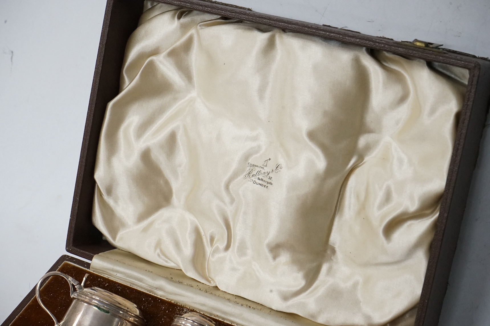A cased George V silver six piece condiment set, by Josiah Williams & Co, with four later associated silver condiment spoons. Condition - fair
